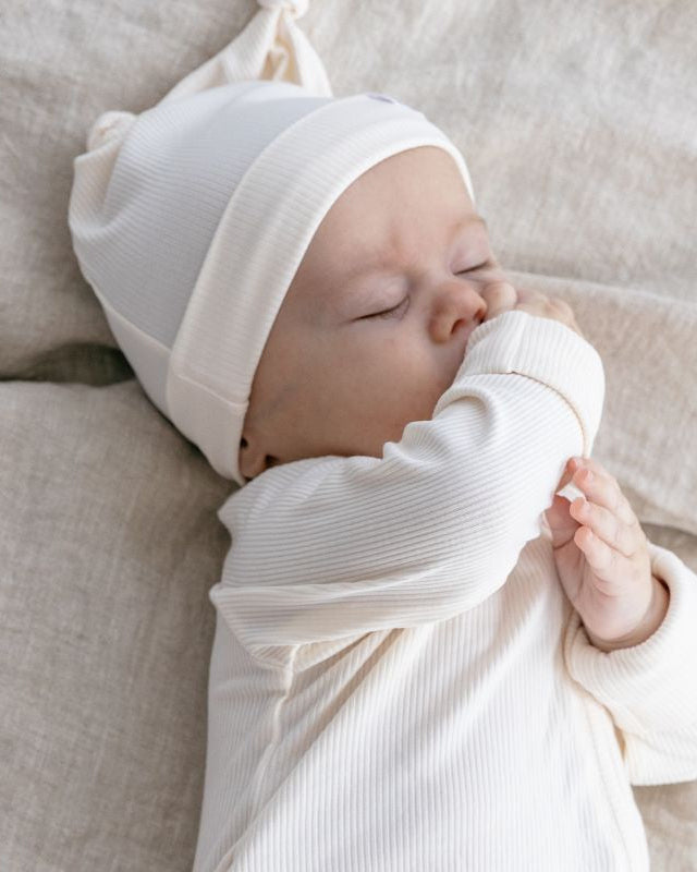 Cream ribbed bamboo baby zippy romper with two-way zip