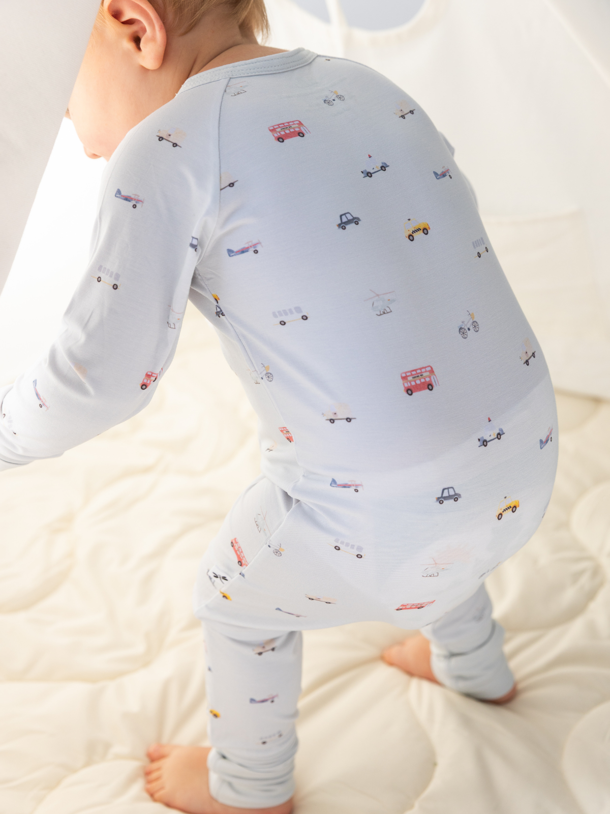 Little Ride print bamboo baby sleepsuit with two-way zip